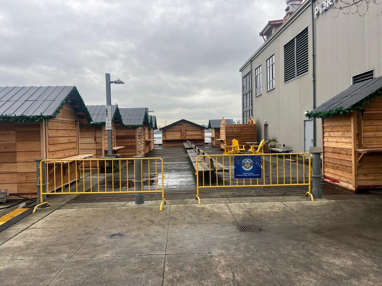 Installed cedar huts lining the waterfront market