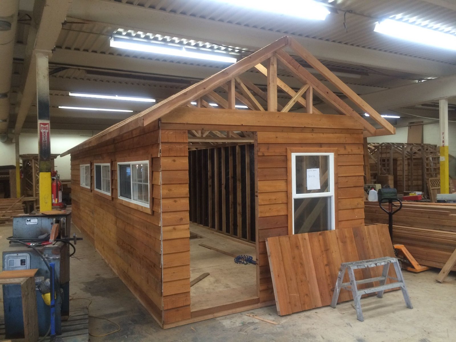 Cedar storage shed with iron hinges