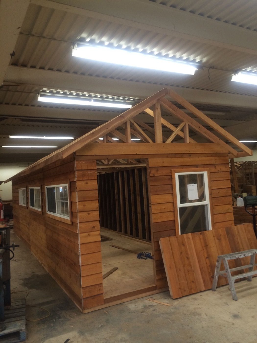 Compact cedar storage shed in the Timberland Langley shop