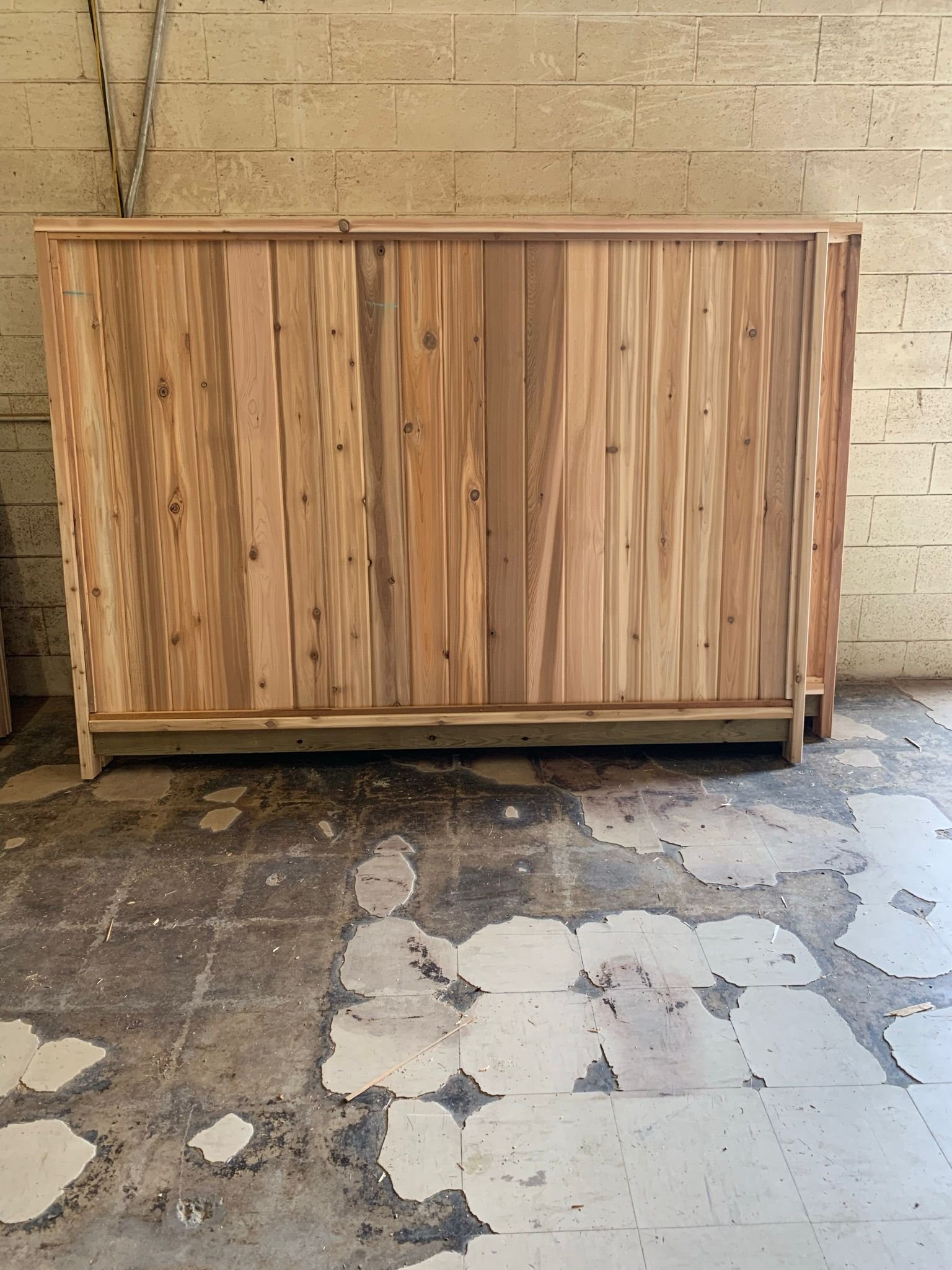 Solid cedar fence panel in Timberland shop